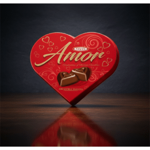 amor chocolate gift, heart chocolate box, valentine's day gift, chocolate truffles, gift bag, hands giving gift, romantic gift, holiday gift, christmas gift, luxury chocolate, present, red gift bag, gold ribbon, gift tag, fireplace, christmas tree.